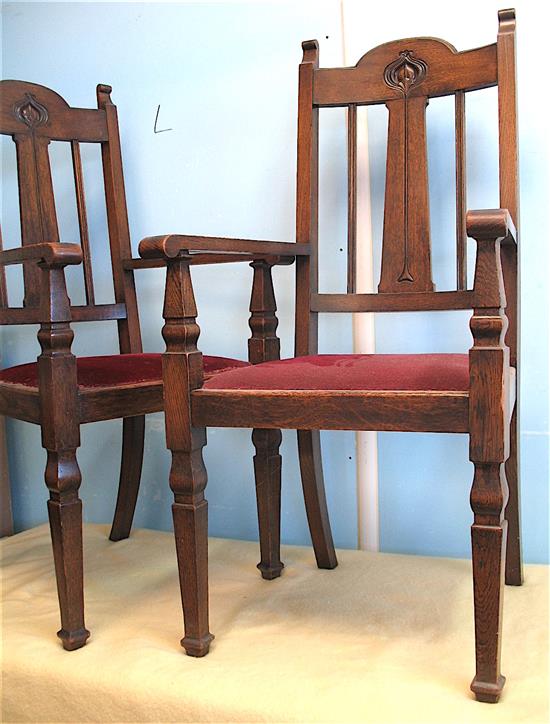 A pair of oak Art Nouveau elbow chairs